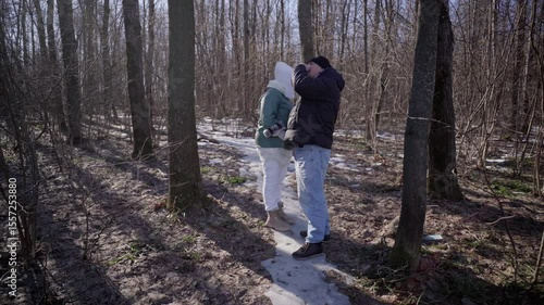 Wallpaper Mural elderly couple enjoys a peaceful walk in the forest, holding hands and smiling. Authentic, unposed moment of love and connection in nature. Perfect for lifestyle, wellness, and aging-related content Torontodigital.ca