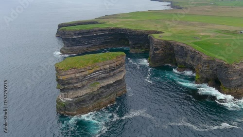 Aerial view of stunning Downpatrick Head coastal landmark with iconic Dun Briste sea stack. Dramatic cliffs and waves. Raw beauty of Ireland's west coast. Wild Atlantic Way Signature Discovery Point.