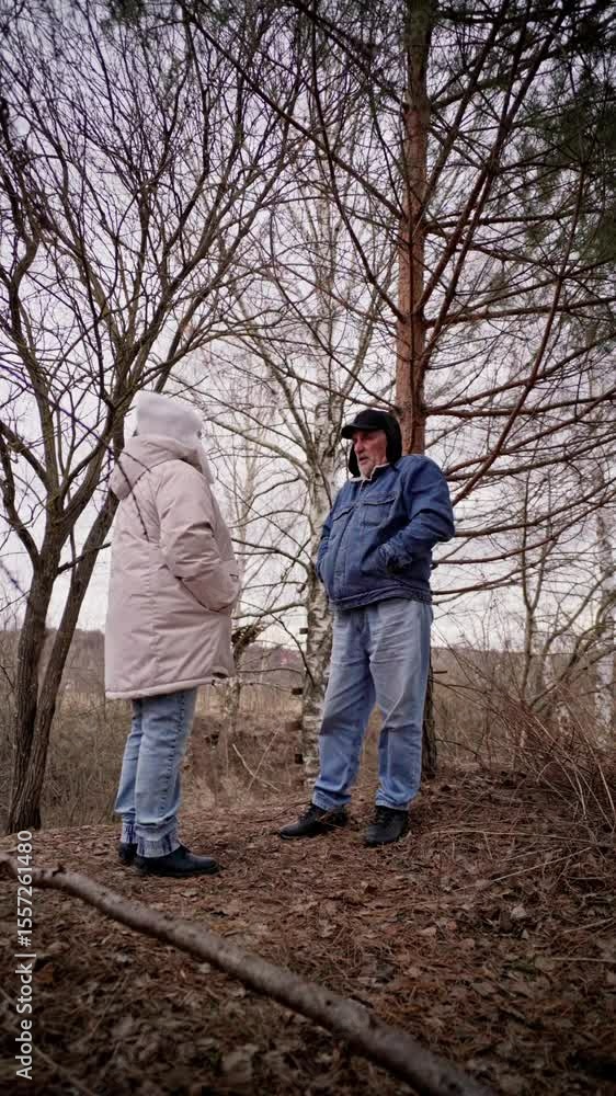 elderly couple enjoys a peaceful walk in the forest, holding hands and smiling. Authentic, unposed moment of love and connection in nature. Perfect for lifestyle, wellness, and aging-related content elderly couple enjoys a peaceful walk in the forest, holding hands and smiling. Authentic, unposed moment of love and connection in nature. Perfect for lifestyle, wellness, and aging-related content