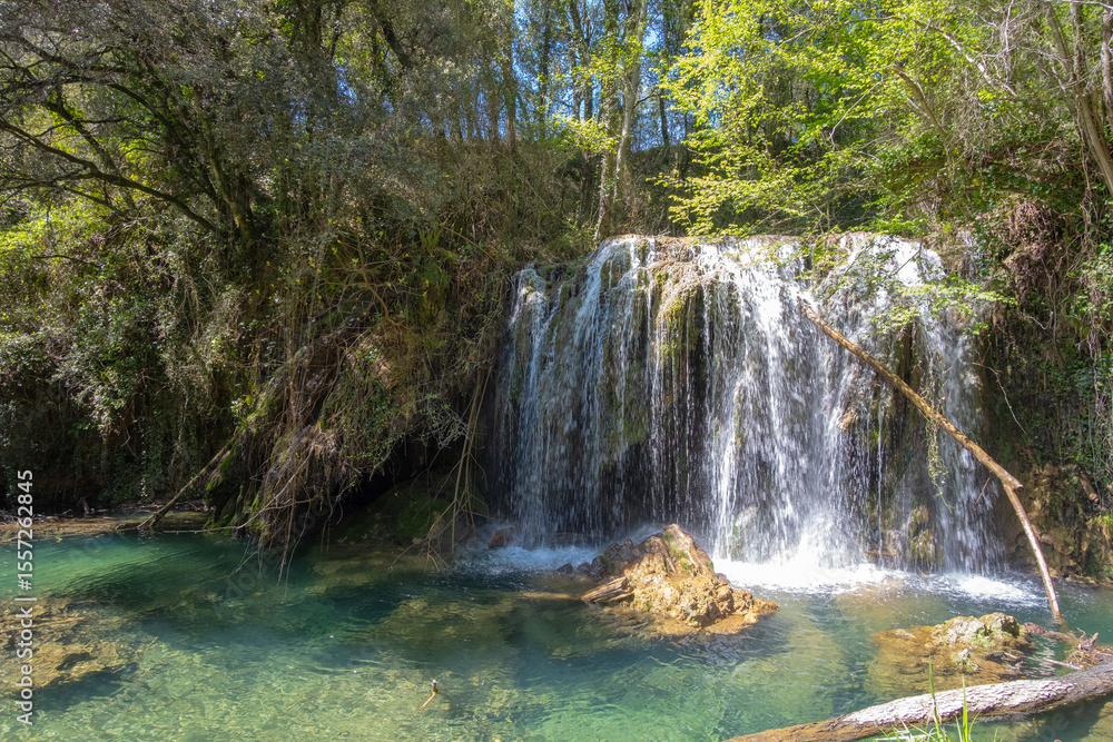 Fototapeta premium Beautiful waterfall on a bright sunny day in a famous river in Girona