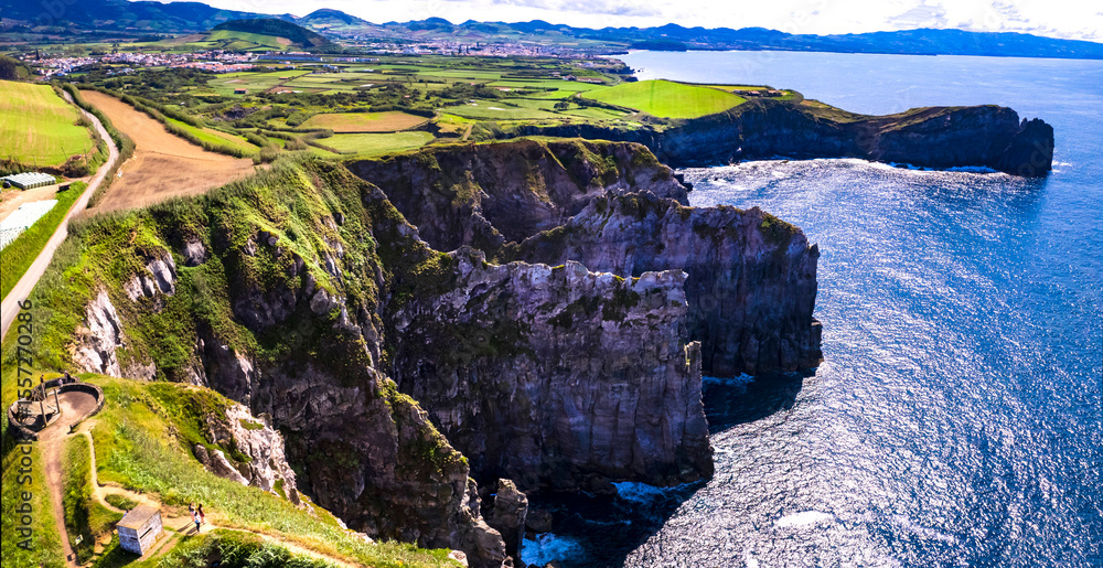 Fototapeta premium Azores , Portugal. amazing Sao Miguel island. aerial drone panorama of miradouro do Cintrao with impressive rugged rocks and ocean in norther part