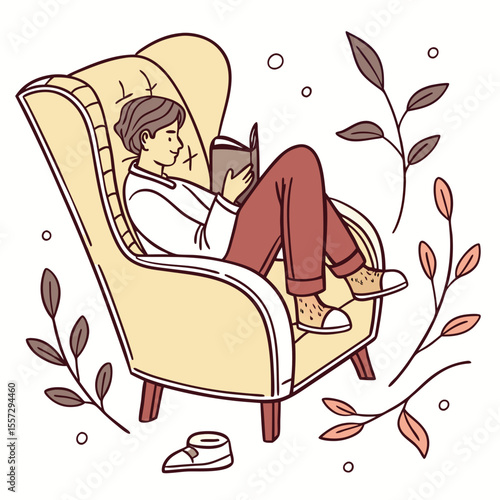 Person reading book in plush armchair surrounded by foliage