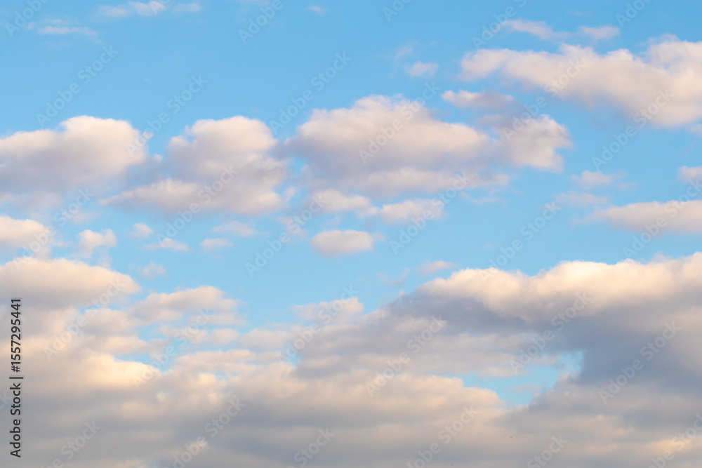 Fototapeta premium Soft pastel clouds in blue evening sky.