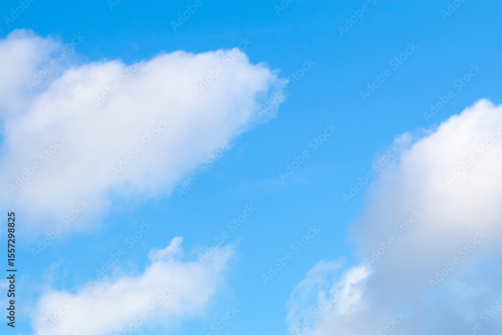 Bright blue sky with white fluffy clouds Bright blue sky with white fluffy clouds