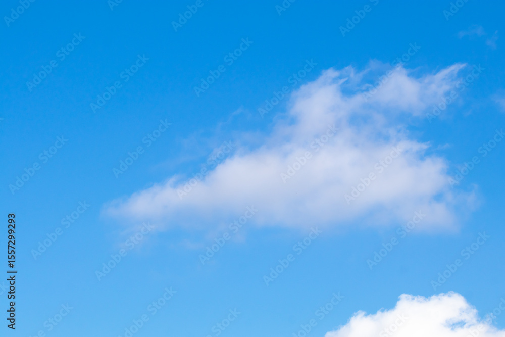 Bright blue sky with white fluffy clouds Bright blue sky with white fluffy clouds