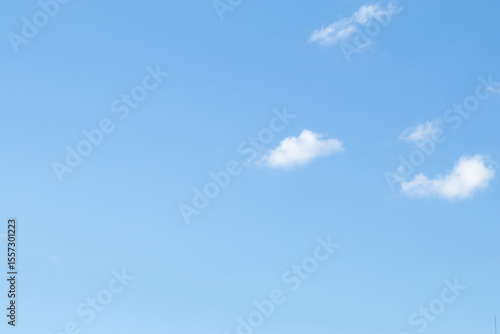 Fototapeta Naklejka Na Ścianę i Meble -  Bright blue sky with white fluffy clouds