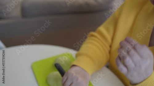 Wallpaper Mural An elderly woman enjoys a healthy meal with fresh salad, fruits, and water in a natural, authentic setting. Warm, real-life moment highlighting mindful eating and joyful simplicity Torontodigital.ca