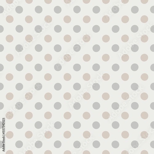 Фотография A pattern of evenly spaced gray and beige polka dots covers a light background, creating a simple yet elegant design