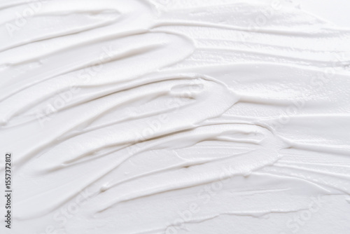 Smear of white cream texture on a white background , Body lotion for perfect skin