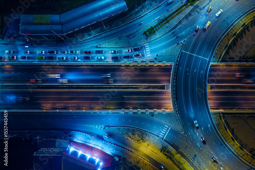 Expressway, Self-driving autonomous electric cars of the future with elements move along a busy traffic intersection. Artificial Intelligence, Car Scan, GPS Tracking, Smart Roads, IoT, highway