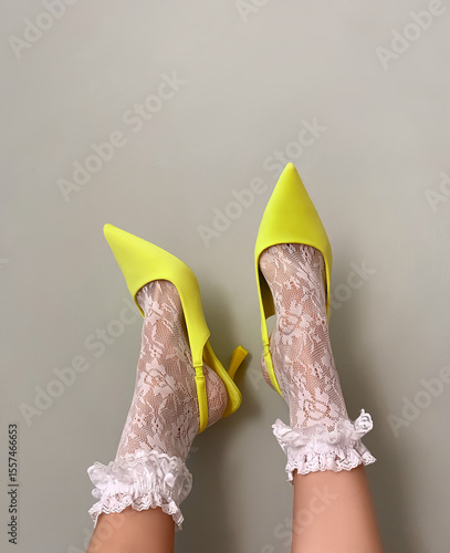 A woman's legs in high heels on an isolated background