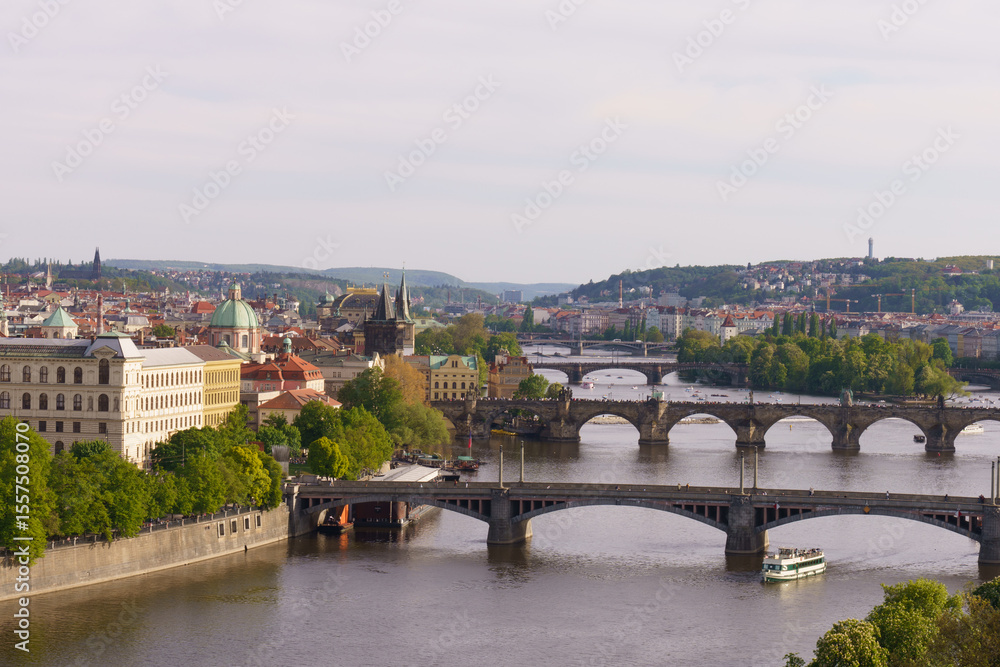 Fototapeta premium Panoramic view of Prague with Vltava River and historic bridges