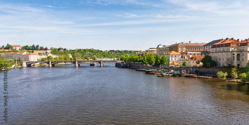 Fototapeta premium Panoramic view of Prague with Vltava River and historic bridges