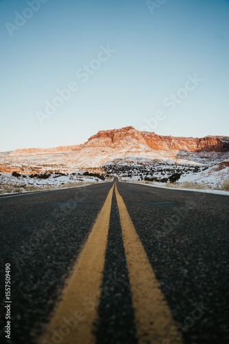 Open Road Through Red Rock Desert in Winter