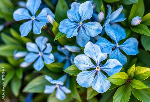 Wallpaper Mural Delicate blue watercolor flowers and lush green leaves, vibrant hues,  green leaves,  background Torontodigital.ca