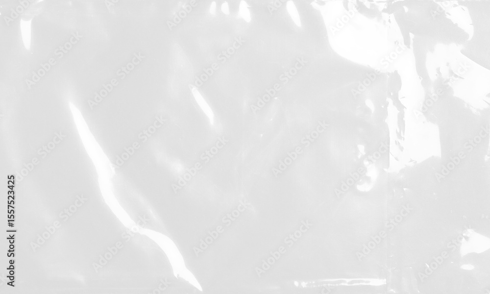 plastic transparent cellophane bag on white background. The texture looks blank and shiny. The plastic surface is wrinkly and tattered making abstract pattern plastic transparent cellophane bag on white background. The texture looks blank and shiny. The plastic surface is wrinkly and tattered making abstract pattern