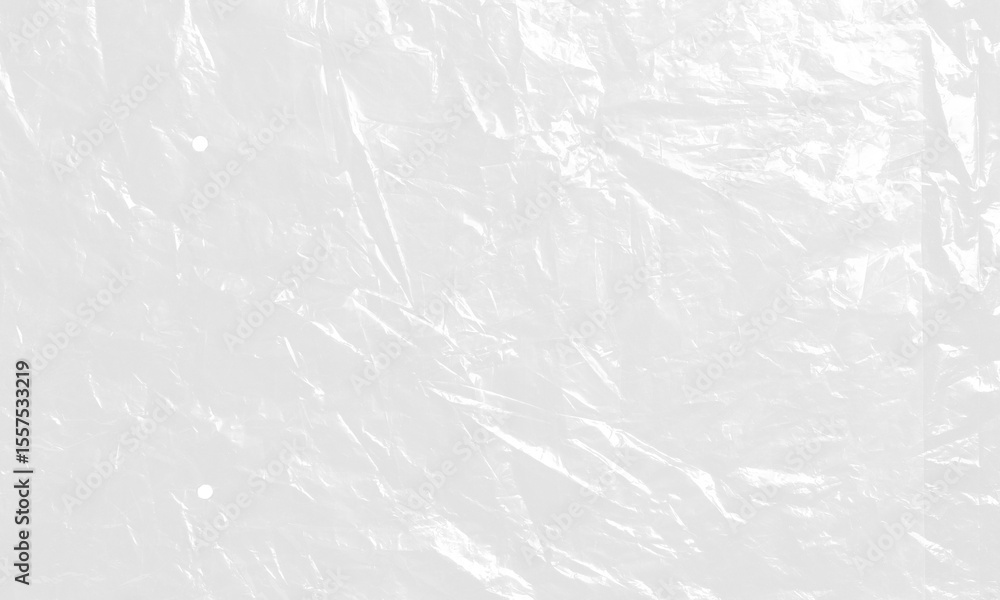 Naklejka premium plastic transparent cellophane bag on white background. The texture looks blank and shiny. The plastic surface is wrinkly and tattered making abstract pattern