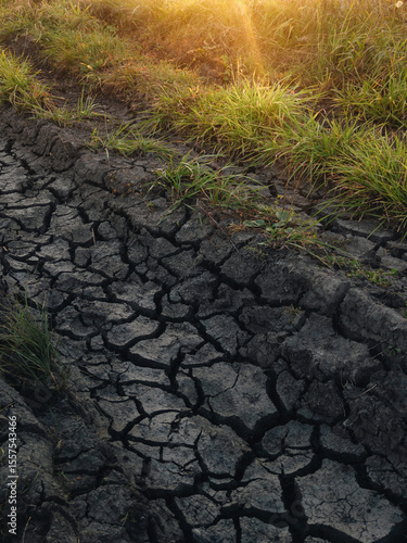 Sunste view over cracked ground field