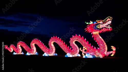A vibrant red Chinese dragon lantern glows against the dark night sky, showcasing Eastern culture with illuminated artistry.