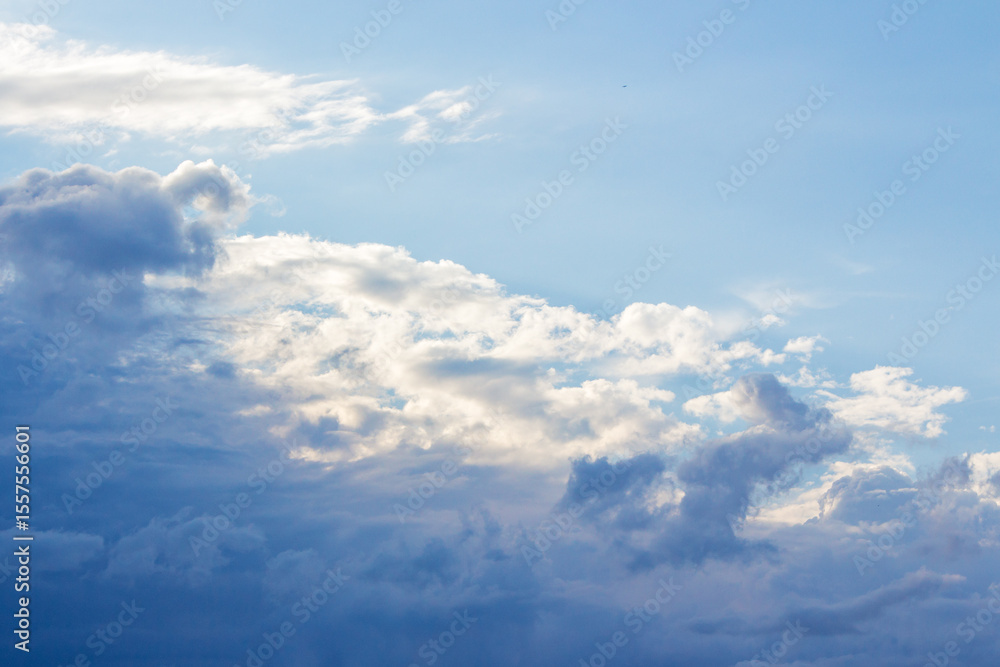 white cumulus clouds on a blue sky. beautiful nature background in afternoon light. sunny weather in summer white cumulus clouds on a blue sky. beautiful nature background in afternoon light. sunny weather in summer