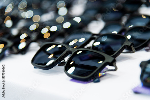 Many sunglasses are displayed in the store