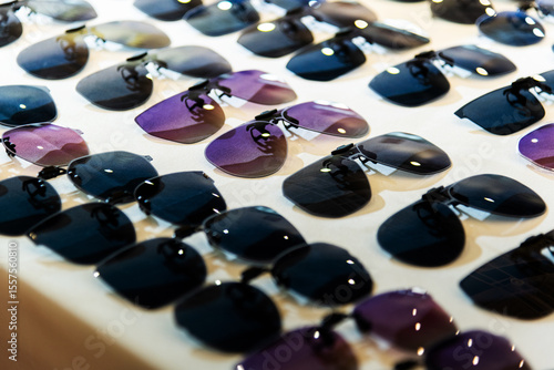 Clip sunglasses are displayed in the store