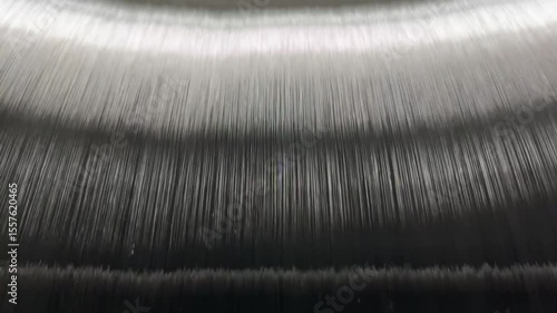 The unwinding of the threads from the bobbin of the warp of the knitting machine