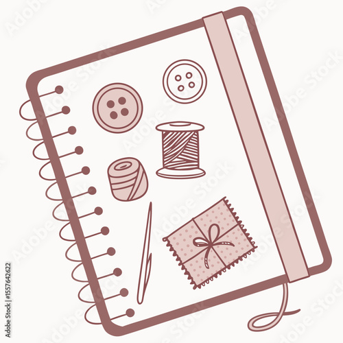 Notebook with sewing supplies and fabric swatch thread spool
