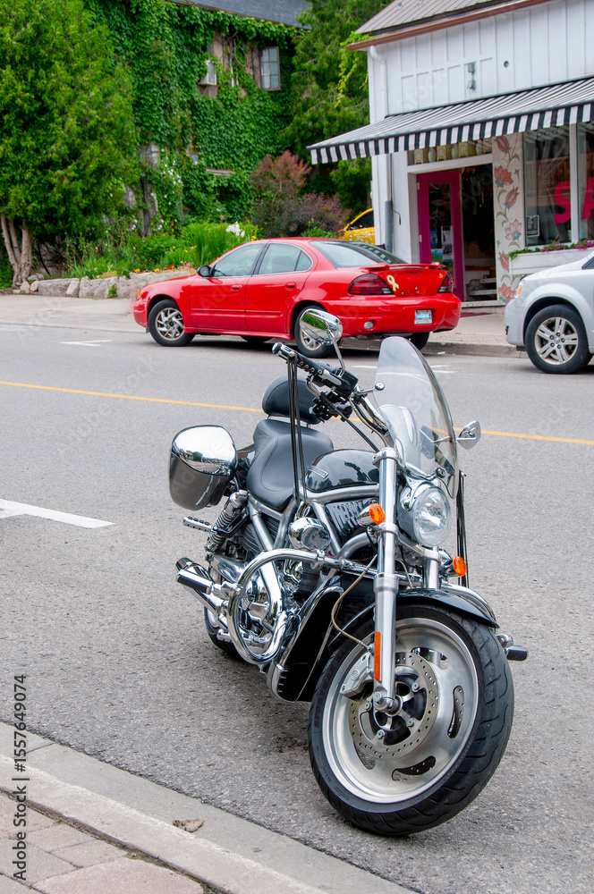 Motorcycle on a Canadian street in a small town Motorcycle on a Canadian street in a small town
