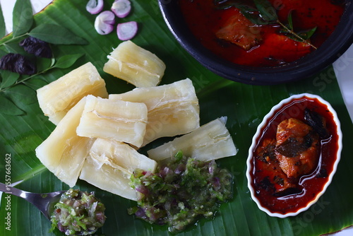 Obraz na plátně Boiled tapioca, kappa served on banana leaf with spicy green chili chutney and v
