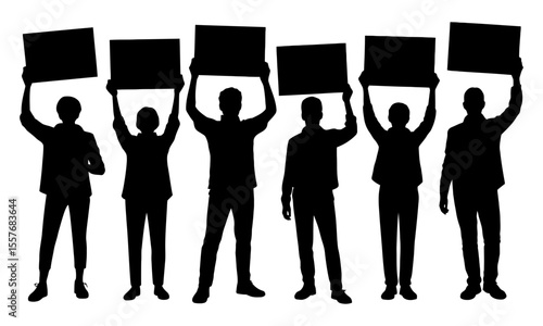Silhouette of people holding up placards