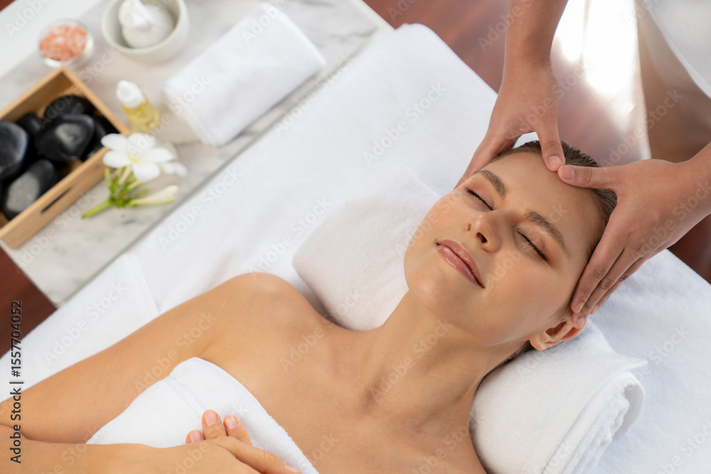 Panorama top view of woman enjoying relaxing anti-stress head massage and pampering facial beauty skin recreation leisure in dayspa modern light ambient at luxury resort or hotel spa salon. Quiescent Panorama top view of woman enjoying relaxing anti-stress head massage and pampering facial beauty skin recreation leisure in dayspa modern light ambient at luxury resort or hotel spa salon. Quiescent