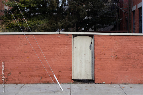 red brick wall with a gate