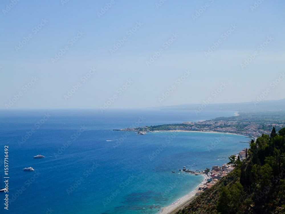 View of the Ionian Sea coast at Taormina town, Sicily, Mediterranean Sea coast. Italy View of the Ionian Sea coast at Taormina town, Sicily, Mediterranean Sea coast. Italy