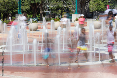 Motion blur of kids playing in Atlanta park fountain