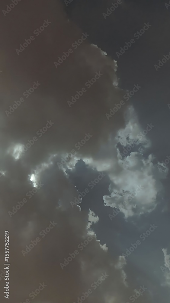 A dramatic sky filled with dark and ominous clouds illuminated by a hidden light source behind them ai generated A dramatic sky filled with dark and ominous clouds illuminated by a hidden light source behind them ai generated