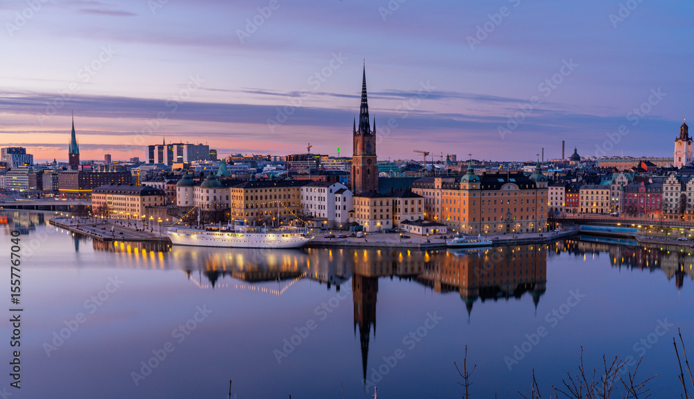 Fototapeta premium Sunset cityscape of Stockholm with Riddarholmen and Old Town waterfront
