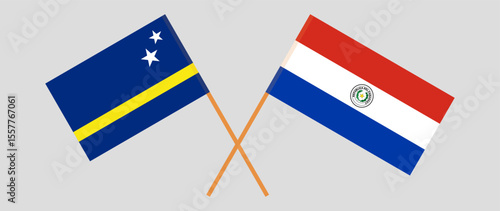 Crossed flags of Country of Curacao and Republic of Paraguay. Official colors. Correct proportion. Vector illustration