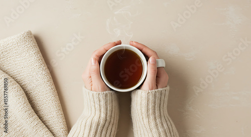 Cozy Autumn Vibes Warm Hands Holding a Steaming Cup of Tea