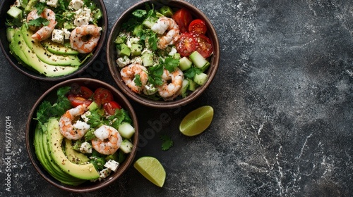 Wallpaper Mural Overhead view of bowls with shrimp avocado salad on gray marble surface Torontodigital.ca