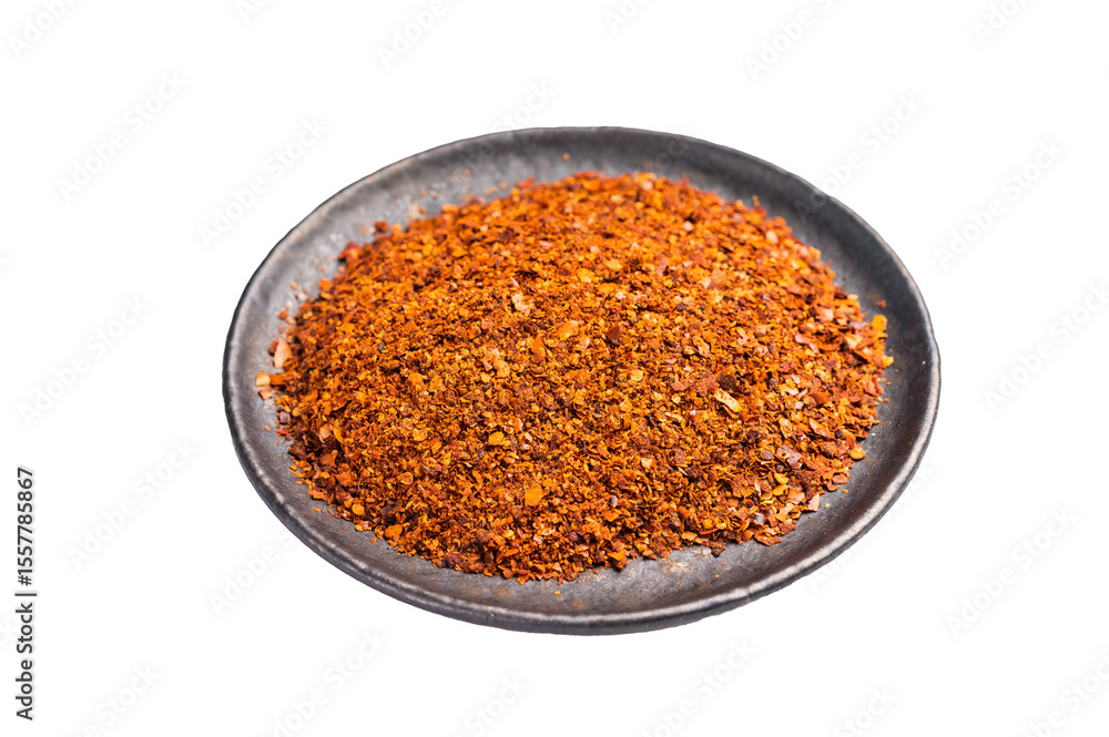 Chili pepper and paprika red flakes in a bowl isolated on white background. top view Chili pepper and paprika red flakes in a bowl isolated on white background. top view