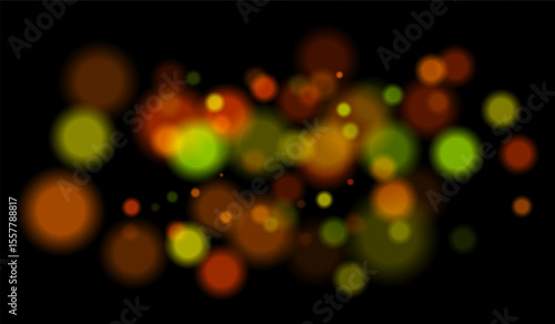 Multicolored blurred bokeh particles with violet, blue, pink hues floating on black background, creating festive or dreamy abstract composition.