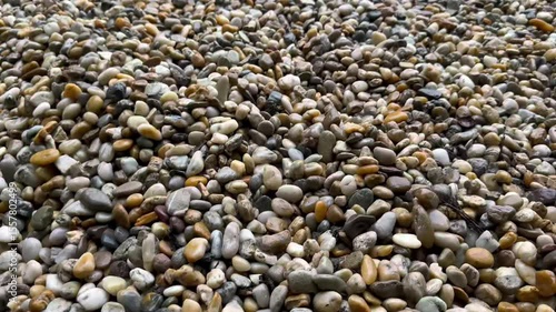 Colorful Pebbles Close-Up on River Shore