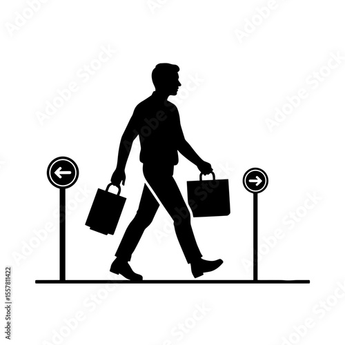 Man carrying duty-free shopping bags walking at airport direction signs  