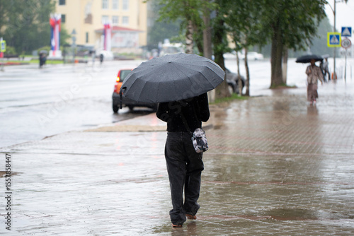 Fototapeta It's raining in the city