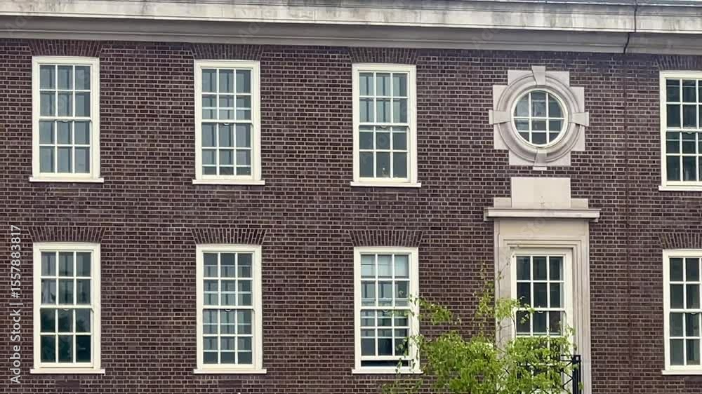 London city scene capturing the refined charm of traditional British architecture, with facades, windows, and materials reflecting historic elegance, slow motion London city scene capturing the refined charm of traditional British architecture, with facades, windows, and materials reflecting historic elegance, slow motion