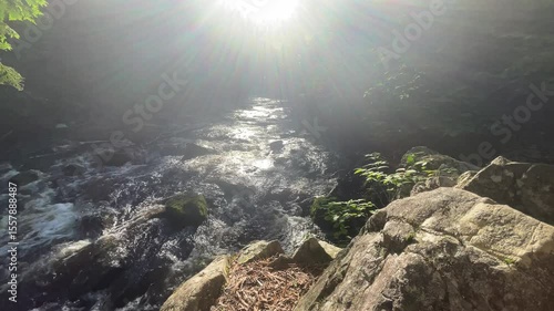Sun rays and waterfall