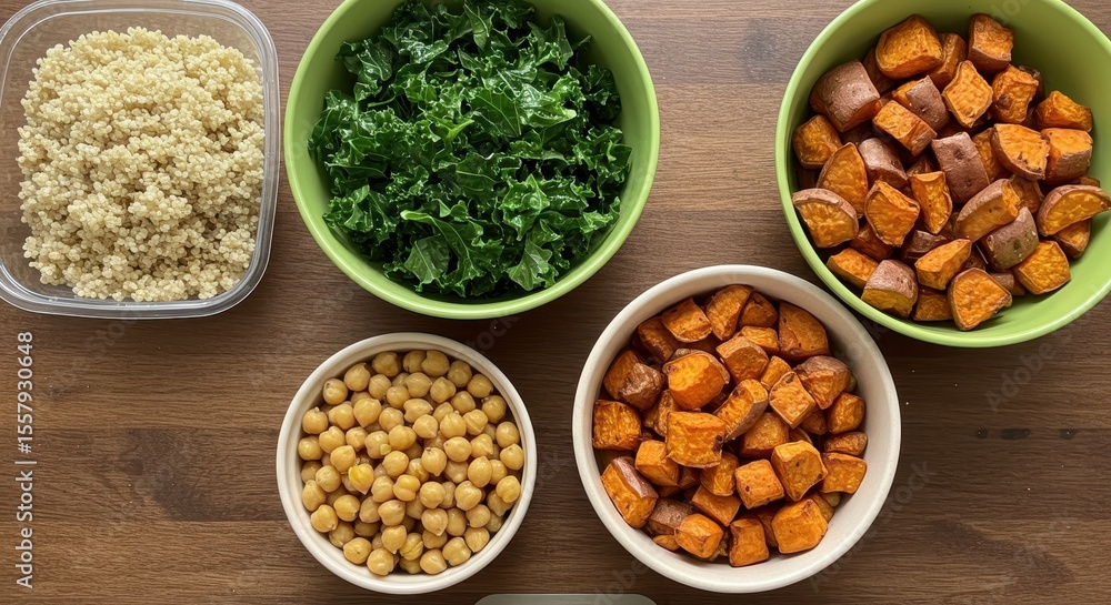 Fresh Ingredients for Healthy Cooking with Quinoa, Kale, Chickpeas, and Sweet Potatoes in Bowls on Wooden Table Fresh Ingredients for Healthy Cooking with Quinoa, Kale, Chickpeas, and Sweet Potatoes in Bowls on Wooden Table
