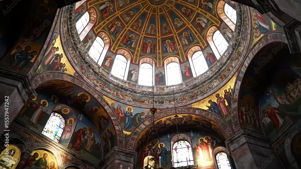 Ornate church dome with painted figures, windows letting light in Ornate church dome with painted figures, windows letting light in