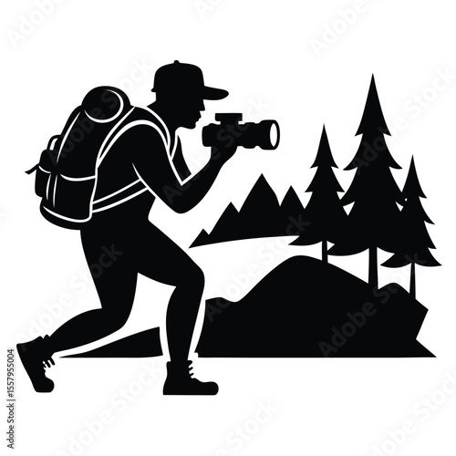 Silhouette of a photographer hiking in the mountains with trees and backpack